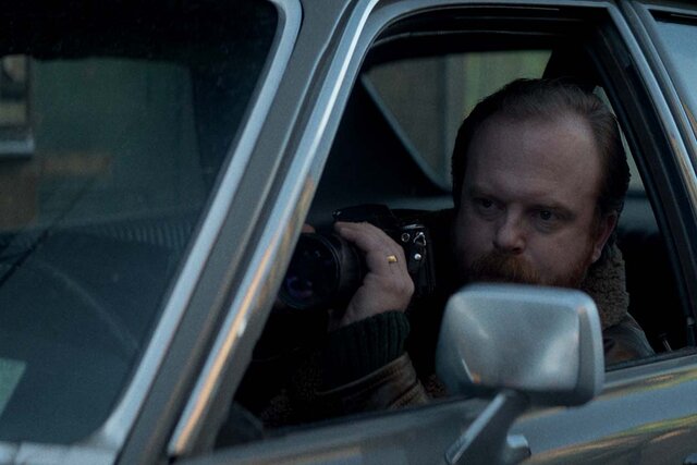 Jeremy Bob as Mayhew sits in a car in The Continental: From the World of John Wick