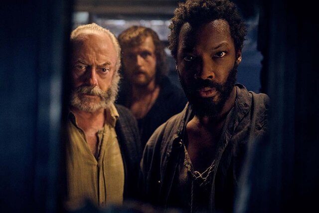 (from left) Captain Eliot (Liam Cunningham), Abrams (Chris Walley) and Clemens (Corey Hawkins) look in The Last Voyage of the Demeter (2023)