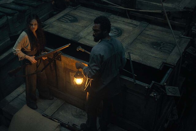 (from left) Anna (Aisling Franciosi) and Clemens (Corey Hawkins) in The Last Voyage of the Demeter (2023)