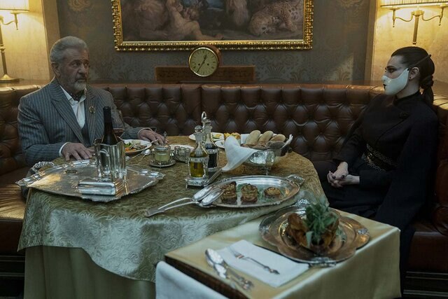 Two men at a table in The Continental: From The World of John Wick Season 1
