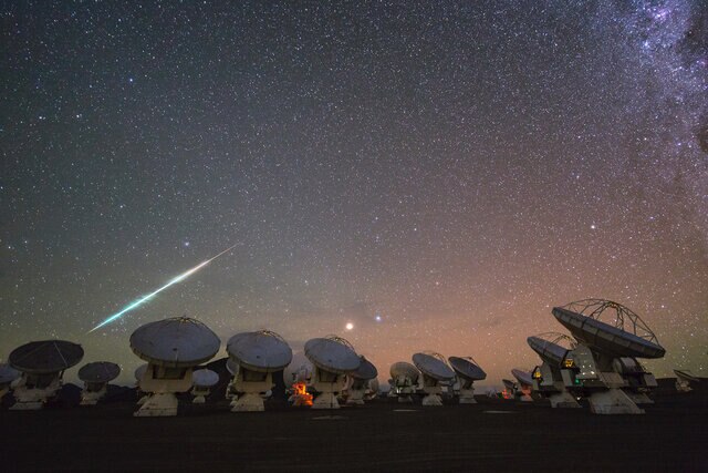A meteor flashes over the ALMA observatory in Chile. The different colors correspond to different elements vaporizing and glowing at characteristic wavelengths. Credit: ESO / C. Malin 