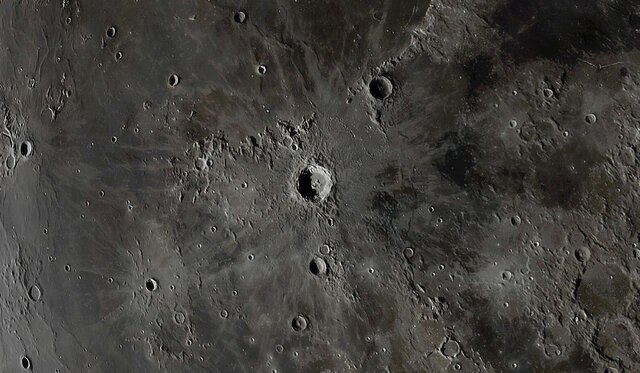 The lunar crater Copernicus, a huge 93-kilometer-wide impact crater in the broad lava plain called Oceanus Procellarum, just to the west of center of the Moon’s face. Credit: Andrew McCarthy