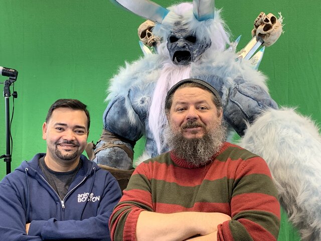Artist Author and Filmmaker Brian R. Hall, with costumed actor Alex Capella Natal, displays creature costumes from his upcoming film in front of a green screen for cosplay fun.Brian Hall & Alex