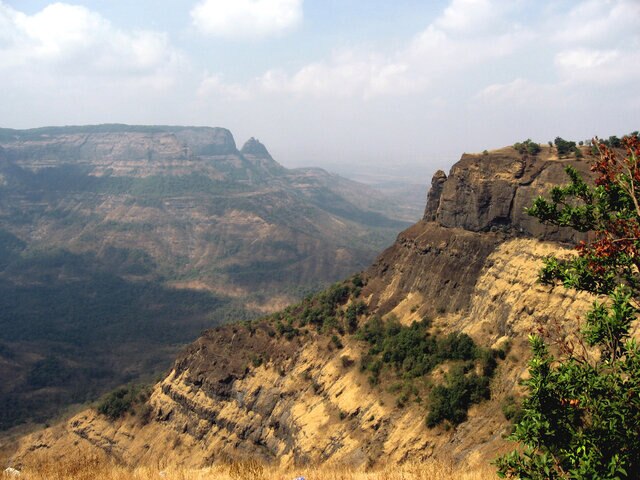 Part of the Deccan Traps in western India. See the layering? That's not sedimentary, that's igneous rock deposition, and it goes on for more than 1,000 kilometers. This was no ordinary volcanic event. Wikipedia / Nichalp