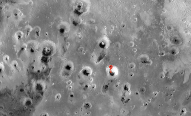 hirise_A field of enormous craters on Mars, many of which have sand blown in them. The red rectangle marks the location and orientation of the Pac-Man dune image Credit: NASA/JPL/ASU/MSSSpacmandune_context