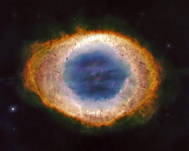 The Ring Nebula, a barrel-shaped shell of gas around a dying star we happen to see end-on. Credit: NASA / ESA / Hubble Legacy Archive / Giuseppe Donatiello