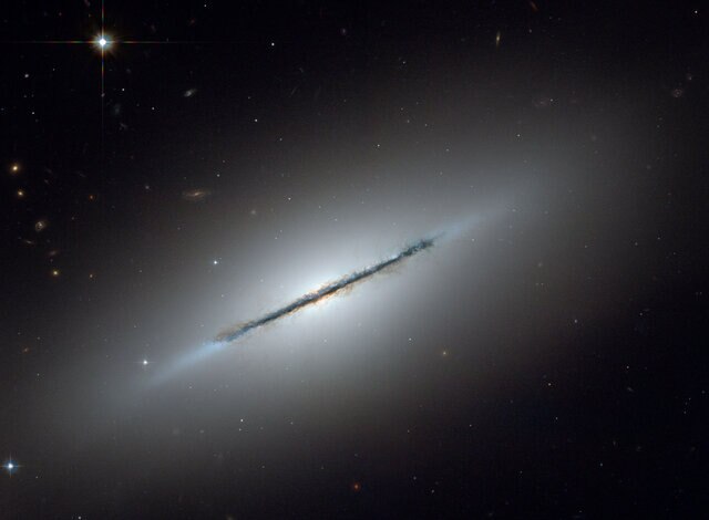 The nearby galaxy NGC 5866 is a disk galaxy seen almost exactly edge-on. Credit: NASA, ESA, and The Hubble Heritage Team (STScI/AURA)