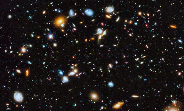 A section of the Hubble Ultra Deep Field, one small spot in the sky filled with galaxies. Nearly every object in this image is a galaxy. Note how the smallest galaxies are a wide variety of irregular shapes.