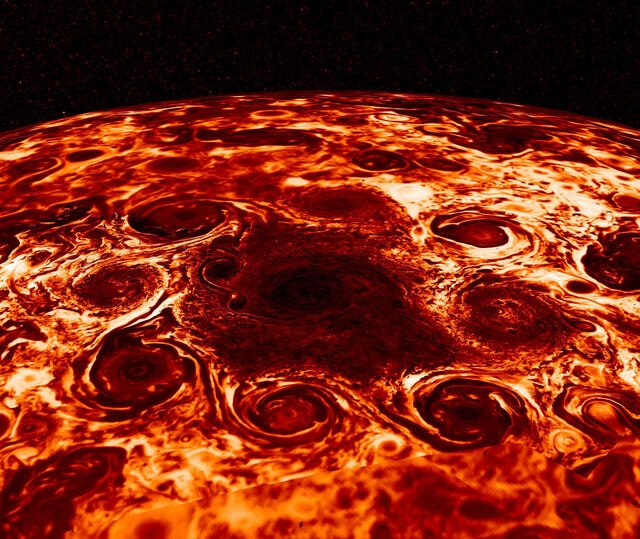 Juno thermal infrared data of Jupiter’s north pole (brighter = warmer) shows eight cyclones swirling around a central cyclone. Credit: NASA/JPL-Caltech/SwRI/ASI/INAF/JIRAM