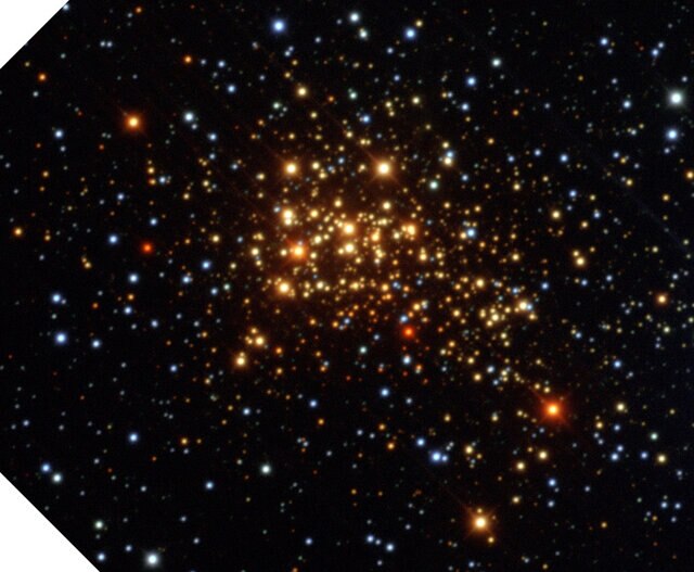 In visible light, the massive star cluster Westerlund 1 appears to be very red, but that’s due to dust between us and it. Credit: ESO