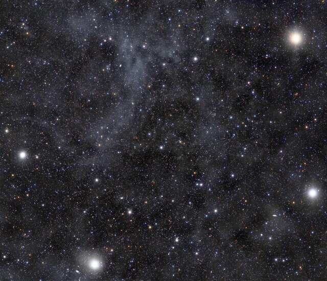 The bowl of the Big Dipper has faint starlight-illuminated dust clouds in it.  Credit: Rogelio Bernal Andreo