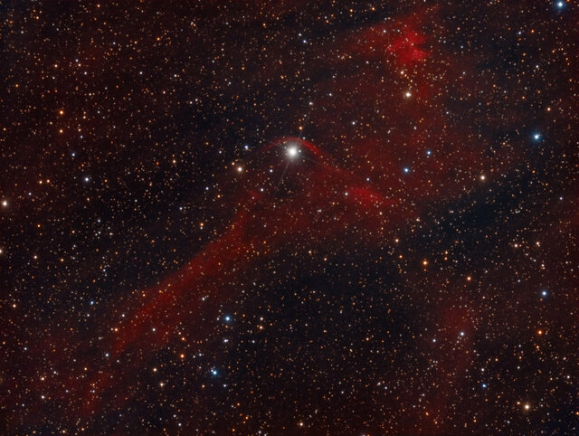 An arc of gas betrays the motion of Vela X-1 through the galaxy; the star is plowing through gas and creating a bow shock. Credit: Rolf Olsen