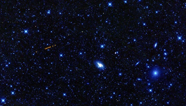 The asteroid Santa glows red in the image from NASA’s WISE observatory. 