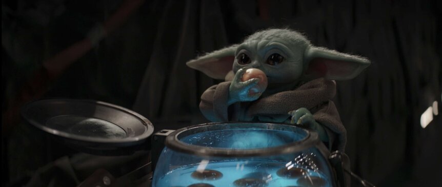 Baby Yoda eating eggs in The Mandalorian