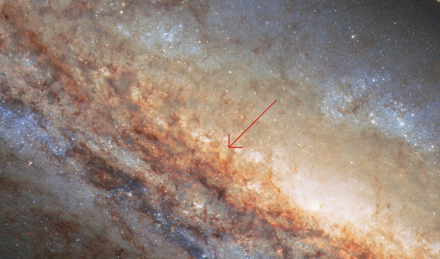 Hubble image of the galaxy NGC 4666 showing the location of the supernova