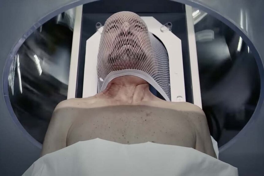 Ben Kingsley entering a machine in Self/Less (2015)