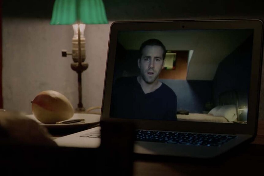 Ryan Reynolds on a computer in Self/Less (2015)