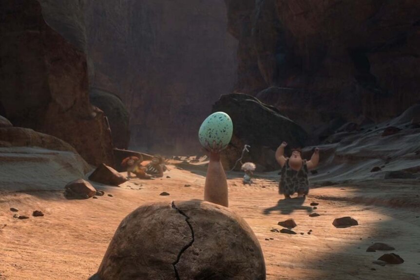 Grug holds up a giant bird egg in The Croods (2013)