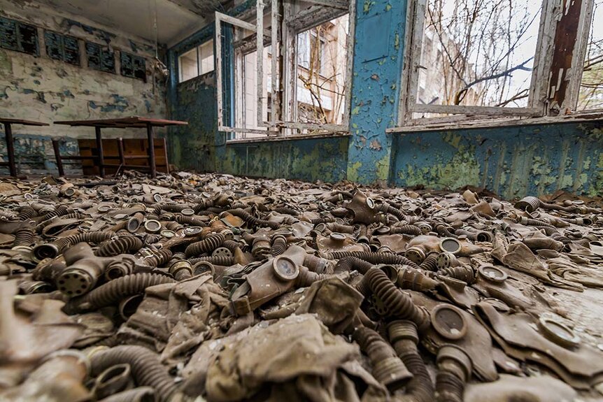 Leaves cover the floor of an abandoned school in the Chernobyl zone in Pripyat, Ukraine