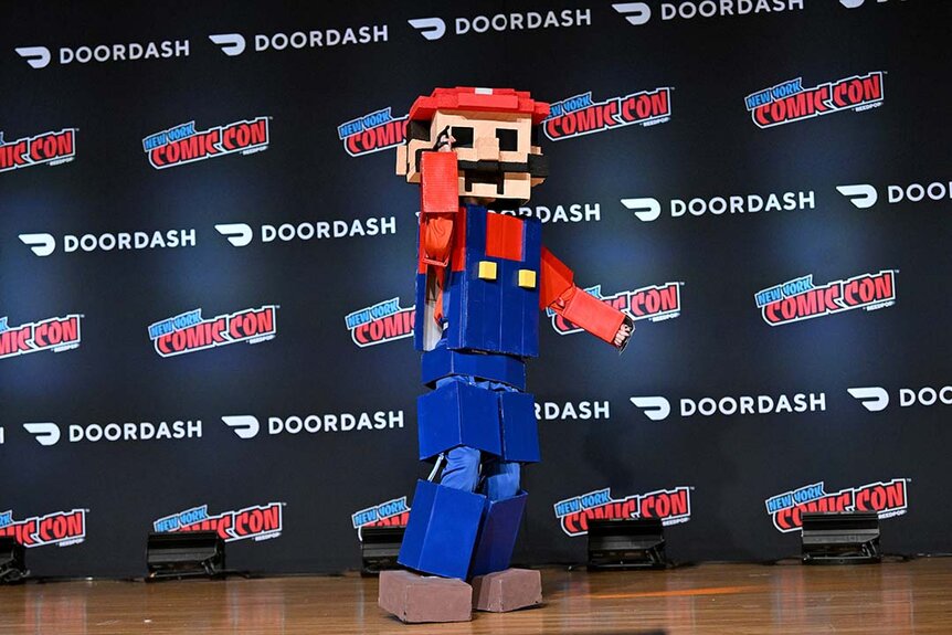 A contestant poses as 8-Bit Mario at the Cosplay Central Costume Showcase during New York Comic Con 2023 - Day 4 at Javits Center.
