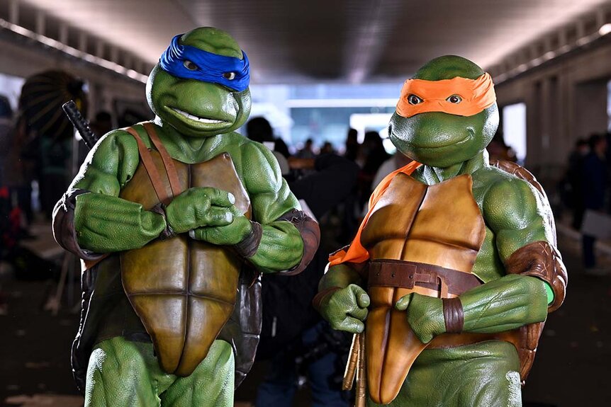 Cosplayers pose as Teenage Mutant Ninja Turtles during New York Comic Con 2023 - Day 4 at Javits Center.