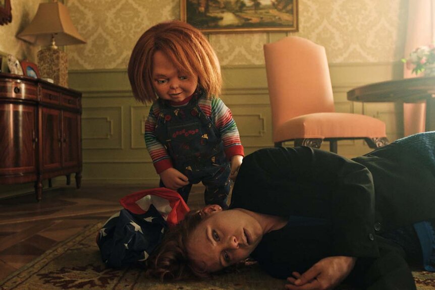 Chucky stands near the body of a dead woman in Chucky 302 -- “Let the Right One In”