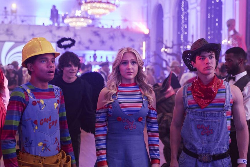 (l-r) Devon Evans (Björgvin Arnarson), Grant Collins (Jackson Kelly), Lexy Cross (Alyvia Alyn Lind), and Jake Wheeler (Zackary Arthur) stand together in Halloween costumes at a party.