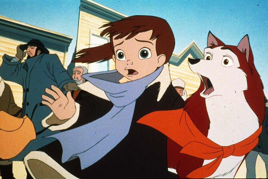 A little boy reaches out for something as Balto (Kevin Bacon) watches worried in Balto (1995).