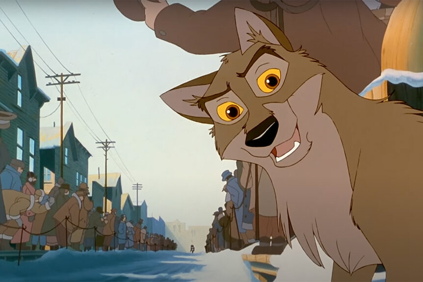 Balto smiles in Balto (1995) while humans wait in a long line.