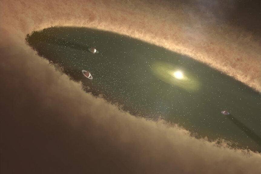 An illustration of an early star system in the process of forming.