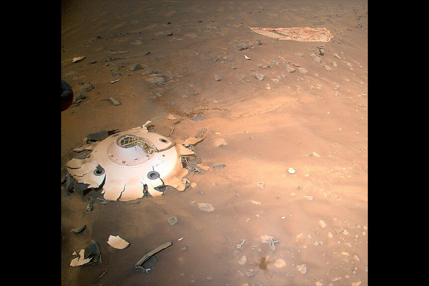 Wrecked Perserverance landing equipment on the surface of Mars