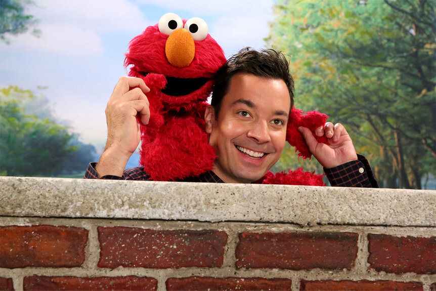 Elmo and Jimmy Fallon during the "Sesame Street Photobomb" sketch during The Tonight Show