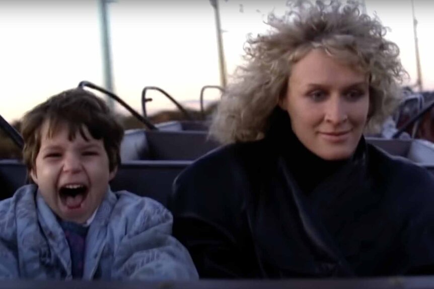 Ellen Gallagher (Ellen Hamilton Latzen) and Alex Forrest (Glenn Close) ride a roller coaster together in Fatal Attraction (1987).