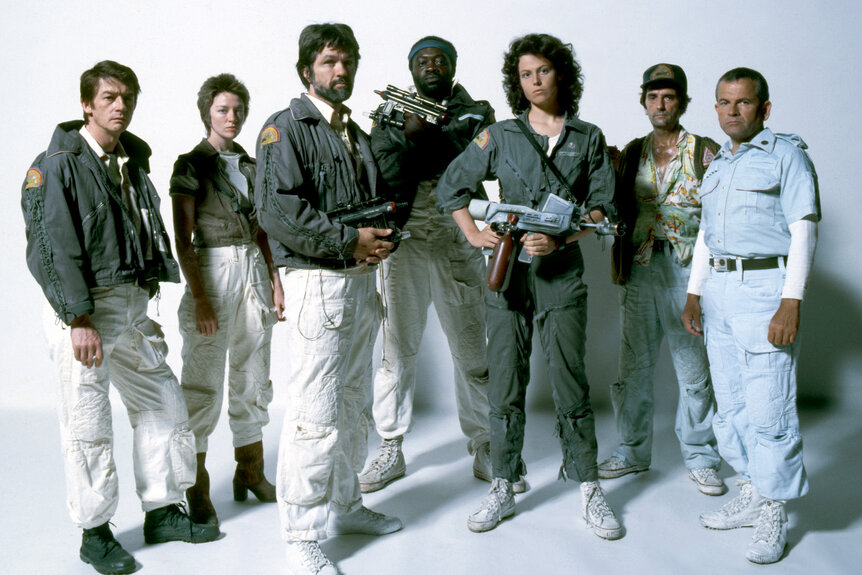 The cast of Alien (1979) pose in uniform.