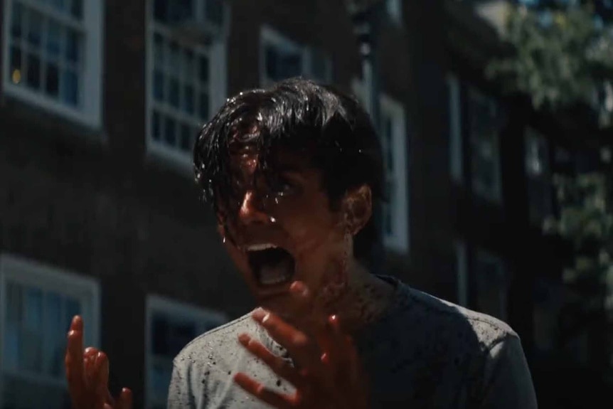 Luke (Miles Robbins) screams while covered in blood in Daniel Isn't Real (2019).