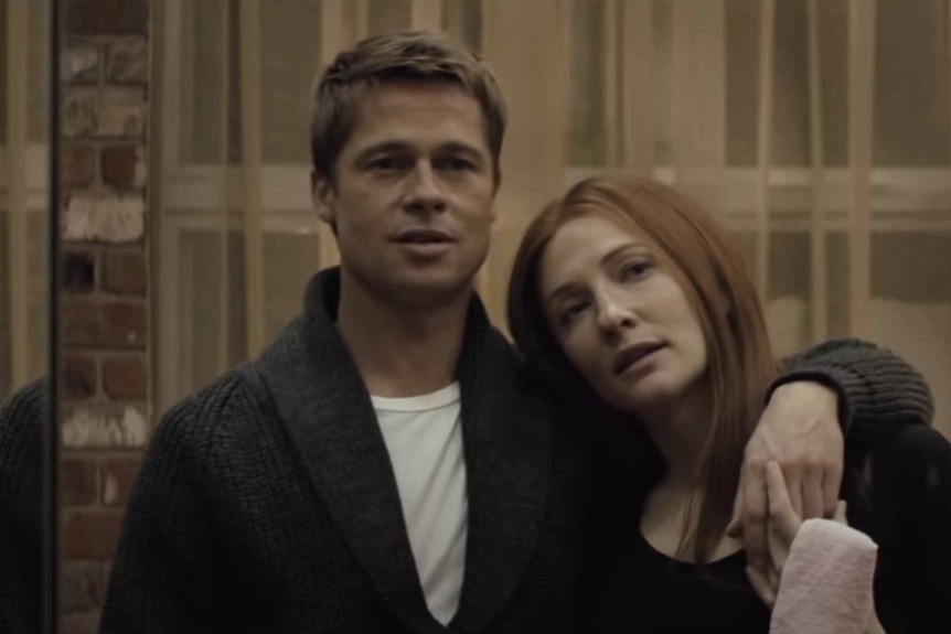 The reflection of Benjamin (Brad Pitt) wrapping his arm around Daisy (Cate Blanchett) in The Curious Case of Benjamin Button (2008).