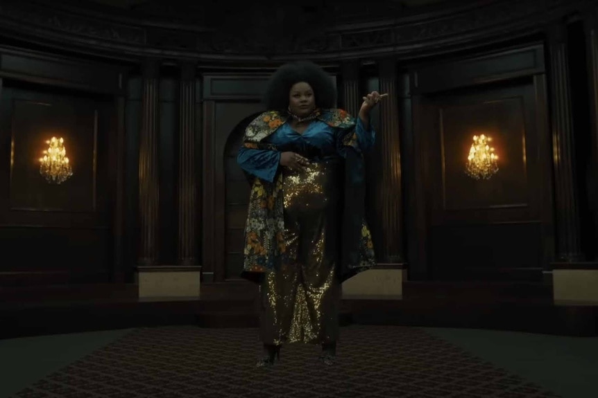 Dede (Nicole Byer) floats in a snazzy outfit The American Society of Magical Negroes (2024)