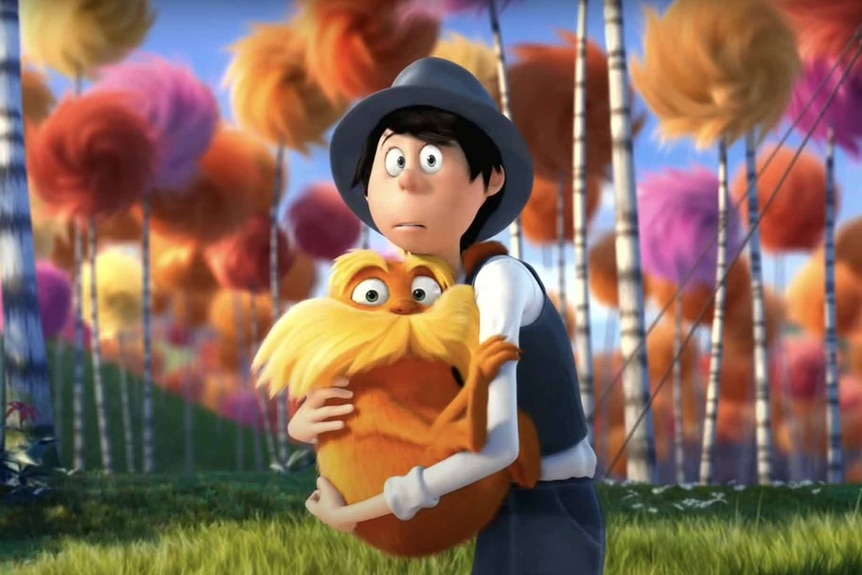 The Lorax (Danny DeVito) and the Once-ler (Ed Helms) hug each other in The Lorax (2012).
