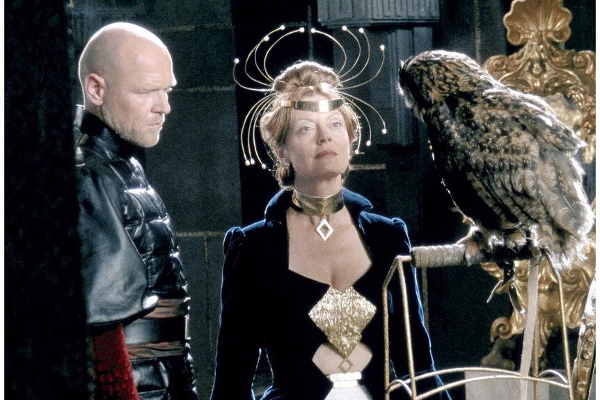 Susan Sarandon, adorned richly, looks at an own in Children of Dune (2003).