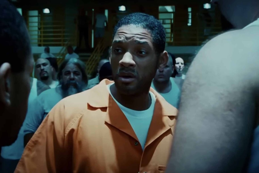 Hancock (Will Smith) wears a prison uniform in Hancock (2008).