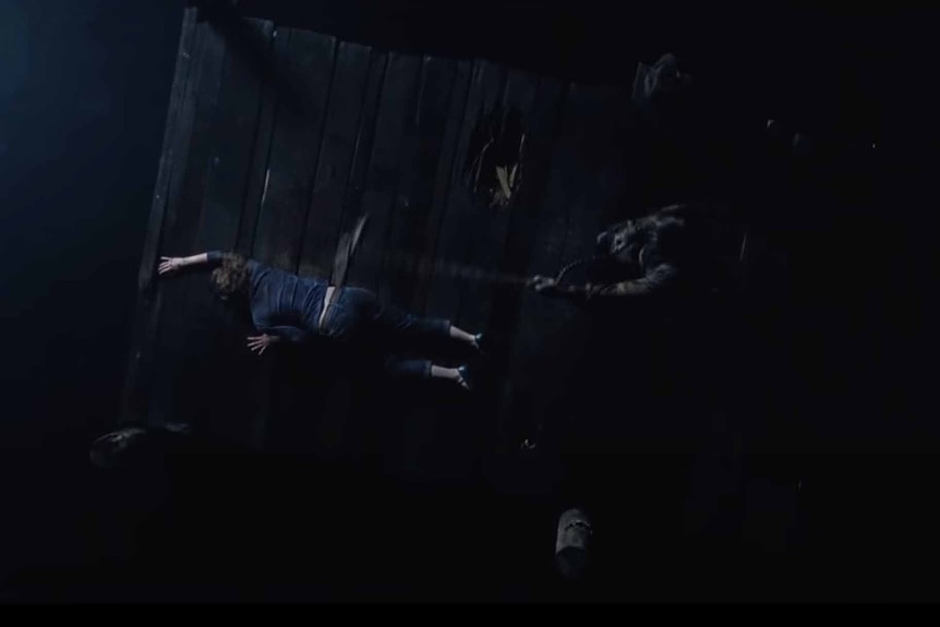 A monster chases someone on a dock in Cabin in the Woods (2012).