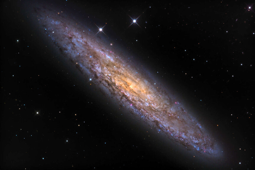 NGC 253, an almost edge-on spiral galaxy about 11 million light years from Earth. Credit: Adam Block/Mount Lemmon SkyCenter/University of Arizona