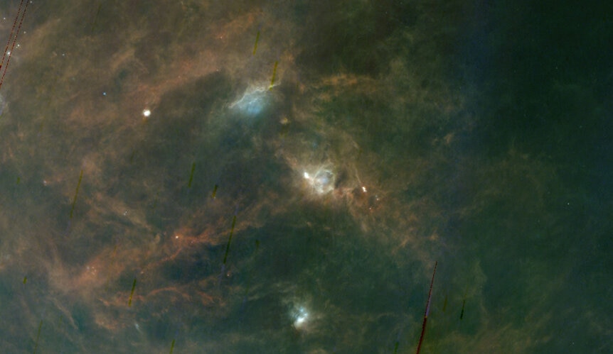 The Perseus Molecular Cloud (center) in context; this image from the AKARI FIS all sky far infrared survey is a whopping 36° across. Credit: Aladin / ISIS / JAXA