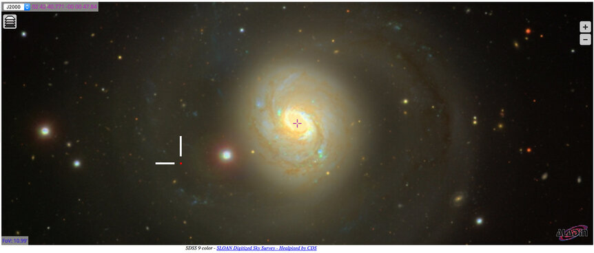 Aladin Lite display of M77 and the location of the asteroid 2003 YP48 at the time of the observation (crosshairs).