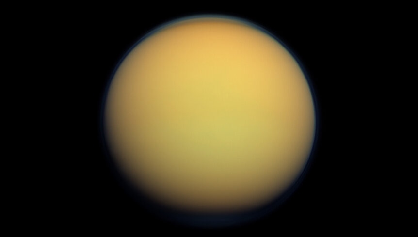 Cassini image of Titan; you can see the haze layer over the north pole. The moon is shrouded in thick haze, giving it that yellowish appearance and hiding surface features. Credit: NASA/JPL-Caltech/SSI