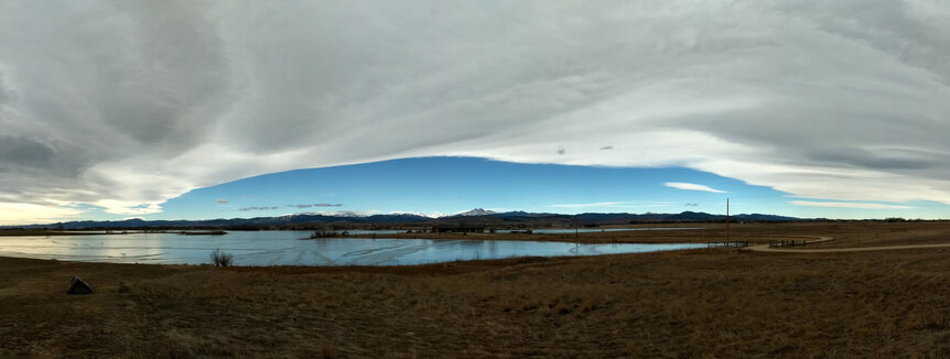 A Chinook Arch, a meteorological phenomenon where rising air over mountains forms a linear cloud edge, can be commonly seen in Colorado. Credit: Phil Plait
