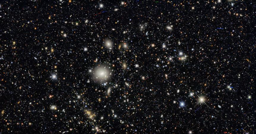 The galaxy cluster WHL J095921.0+011752, at a distance of about 1.5 billion light years from Earth, was one of many clusters examined in the Dark Energy Survey. Almost everything in this image is a distant galaxy. 