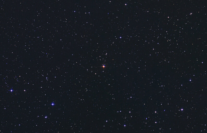 AU Mic (center), a dim red dwarf star just 32 light years from Earth. Credit: DSS/Skyview