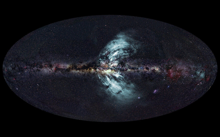 Two huge eruptions of material are streaming out of the Milky Way, seen in gamma rays by the Fermi space telescope. Credit: Ettore Carretti, CSIRO (radio image); S-PASS survey team (radio data); Axel Mellinger, Central Michigan University (optical image);