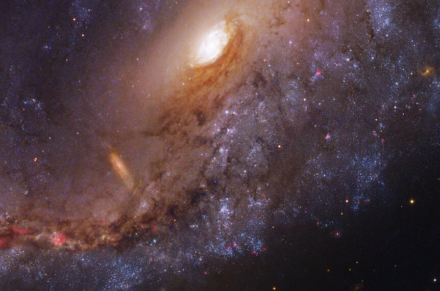 The inner regions of the Meathook Galaxy, NGC 2442, using observations from Hubble and a 2.2 meter telescope in Chile.
